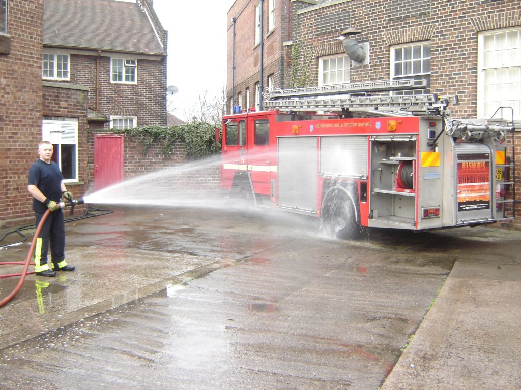 The Fireman Cleaning his machine